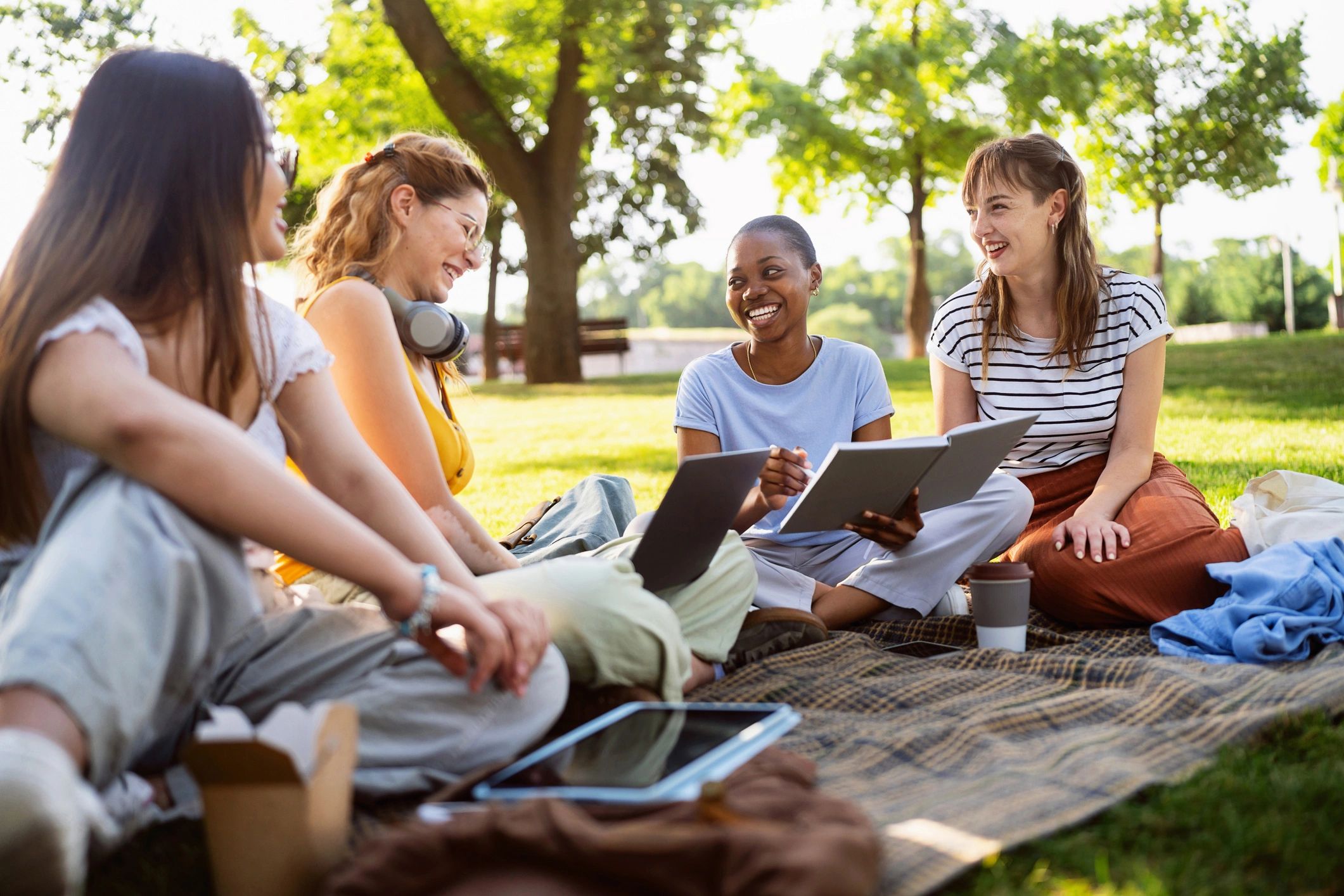 Student studying outdoors on campus